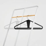 The Slim Kangaroo™ Hanger 40-Pack - Made in Wisconsin, USA with 100% recycled material - The patented design clips in pants, shirts, straps, tanks, jackets and even entire outfits on a single hanger