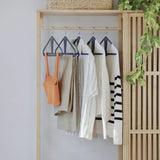 The Slim Kangaroo™ Hanger 40-Pack - Made in Wisconsin, USA with 100% recycled material - The patented design clips in pants, shirts, straps, tanks, jackets and even entire outfits on a single hanger