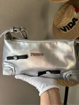 Step into the spotlight with this stunning metallic silver shoulder bag! 🌟 This