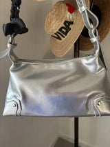 Step into the spotlight with this stunning metallic silver shoulder bag! 🌟 This